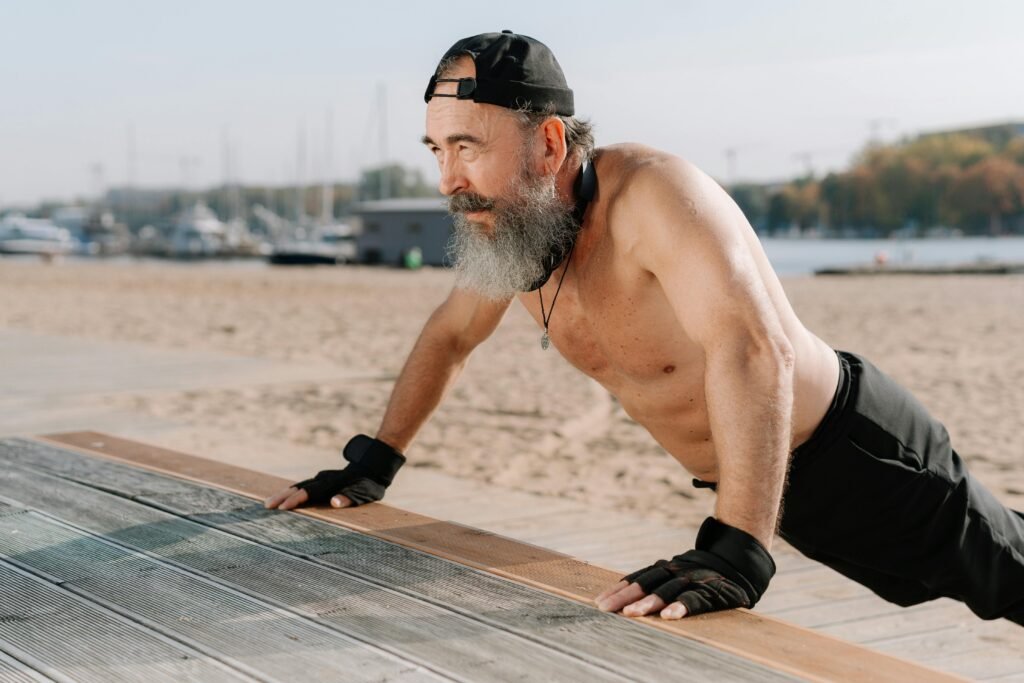Older man exercising at the beach