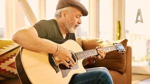 older man over 60 playing guitar part of a blog encouraging men over 60 to learn guitar