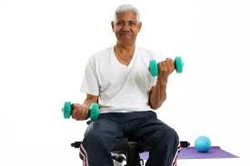 Senior man exercising with dumbbells as part of a strength training program for men over 60